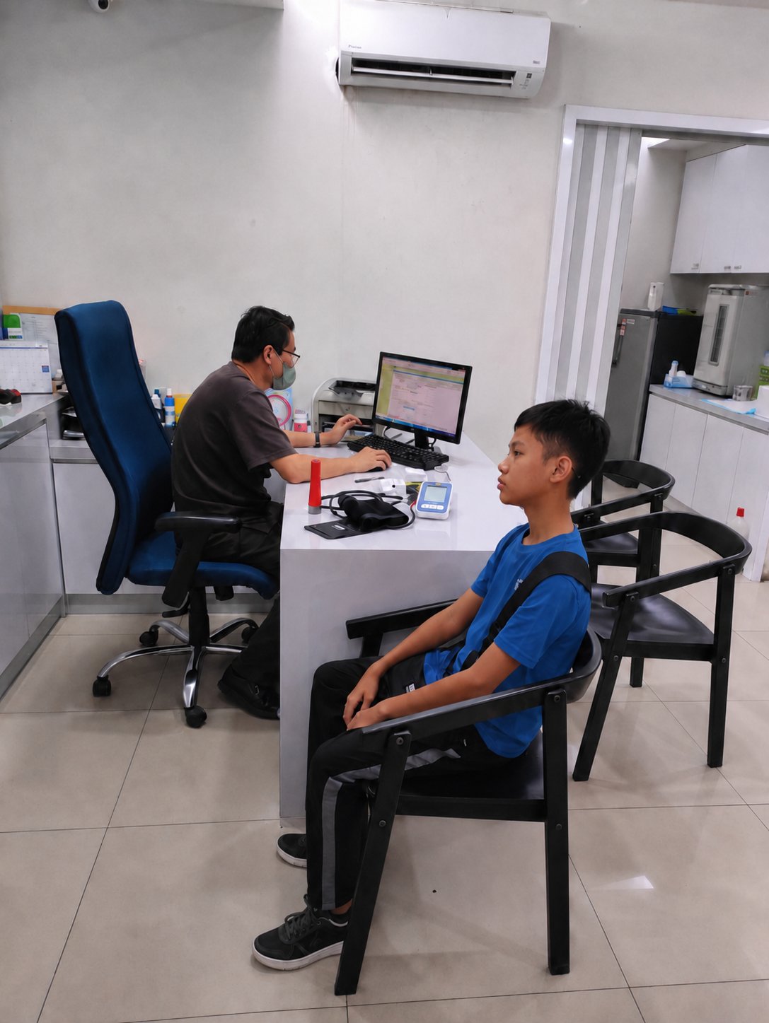 Dr Azahar with patient